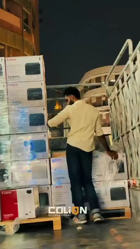 Canon printers moved by trolley for an evening delivery.