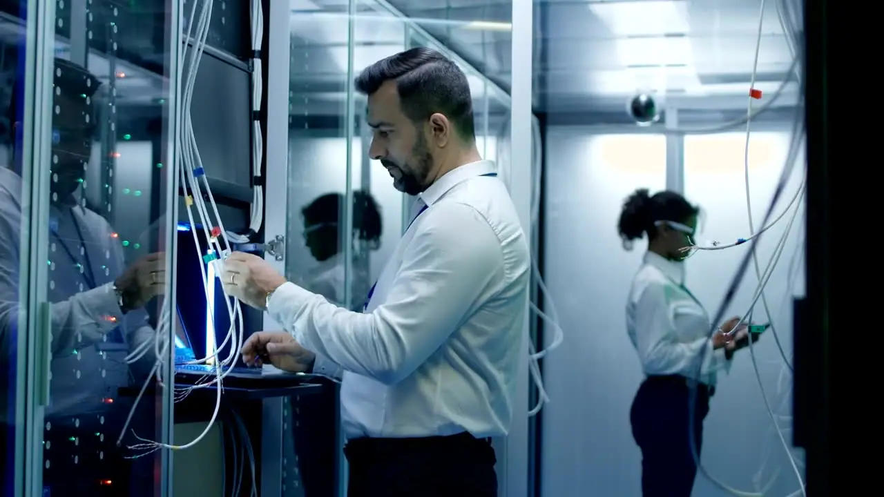 An engineer at a server rack