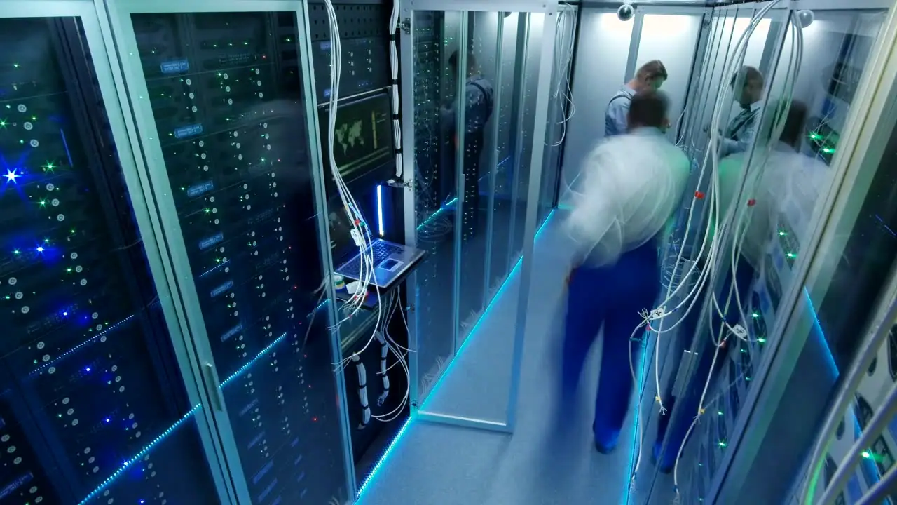 Engineers cabling a server room